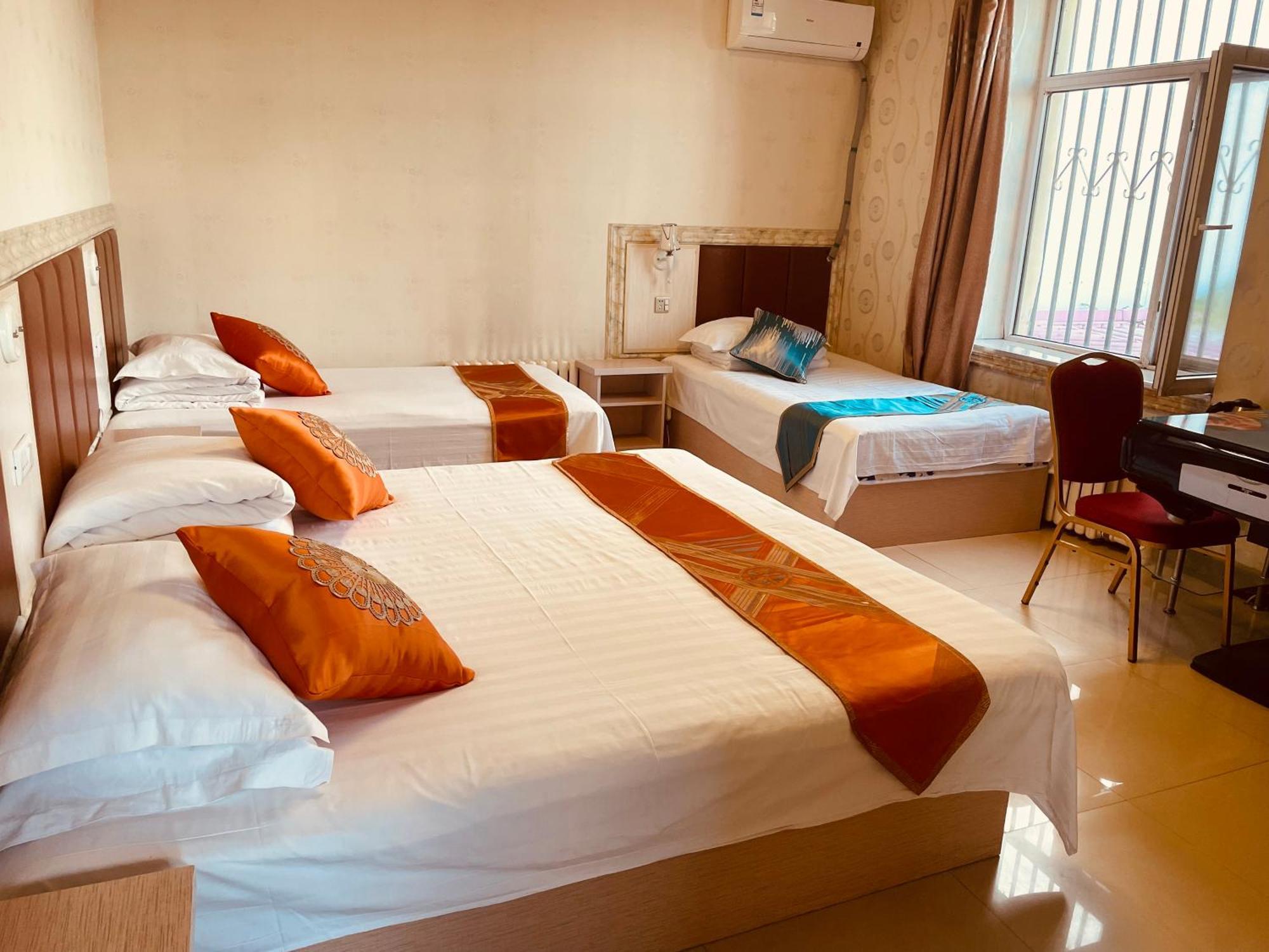 哈尔滨机场东方红运宾馆 Hotell Rum bild
