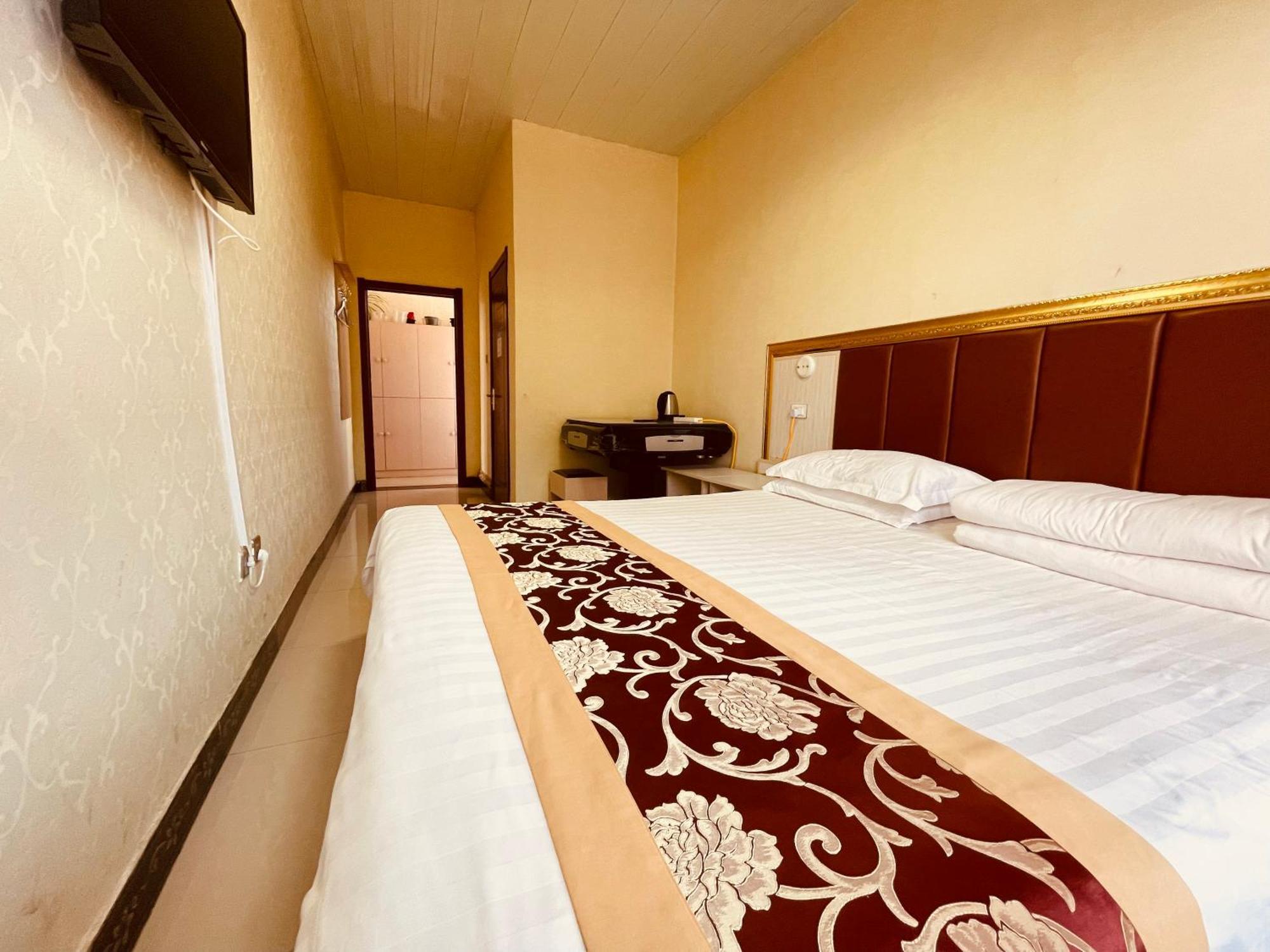 哈尔滨机场东方红运宾馆 Hotell Rum bild